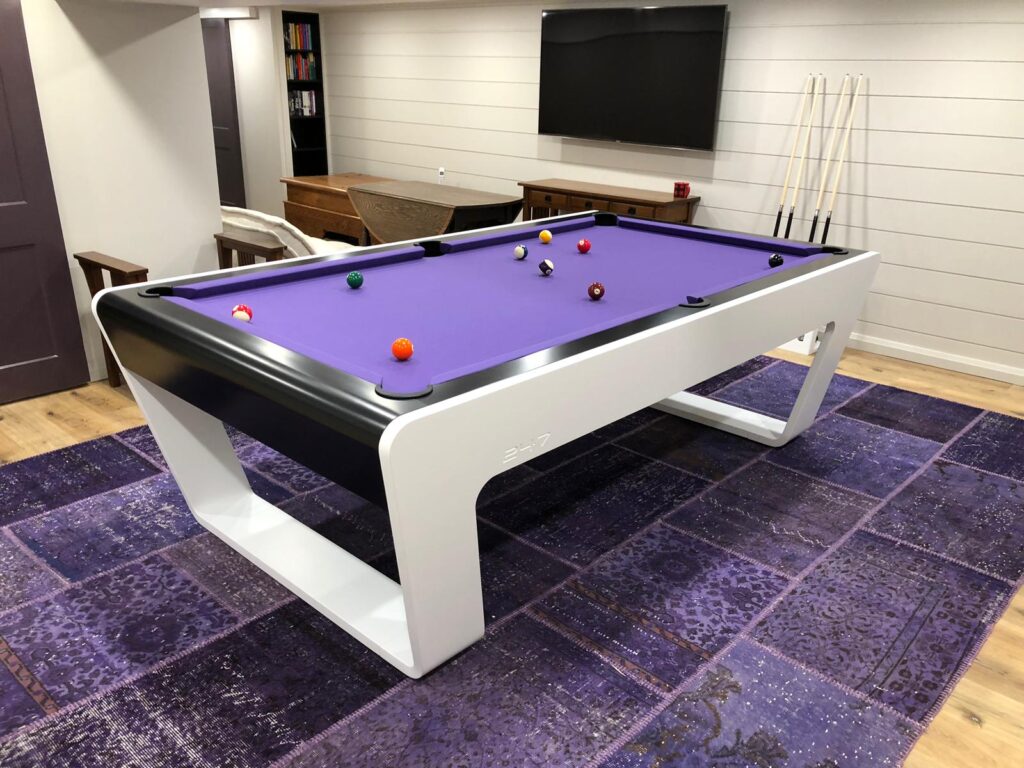 White 724 billiard table with purple playing cloth in a private house in Toronto.