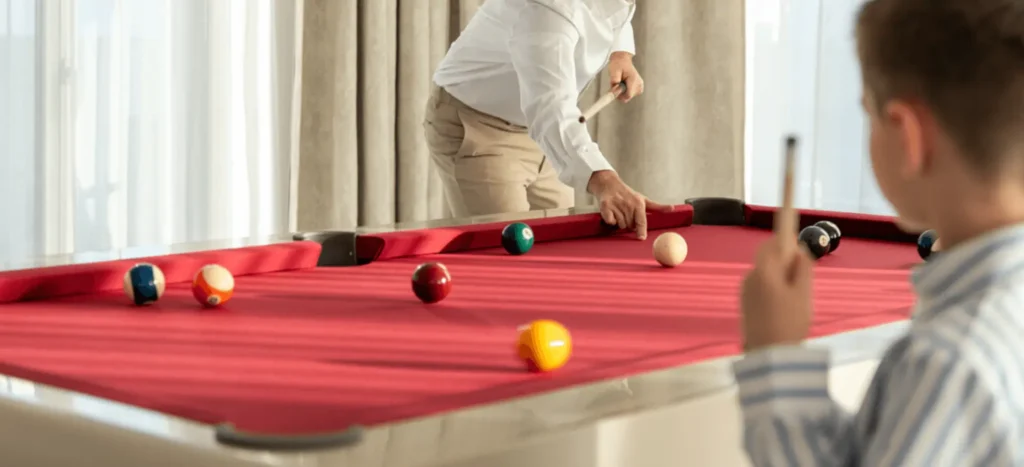 724 billiard table with red playing cloth in a luxury interior at Carlton Cannes.