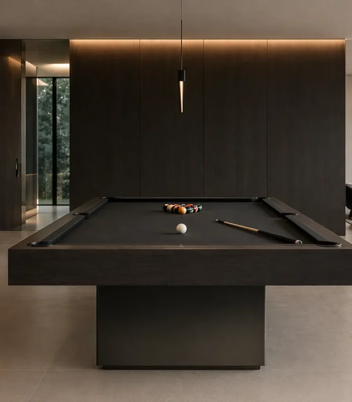 Black luxury pool table with billiard balls in a sophisticated dark interior.